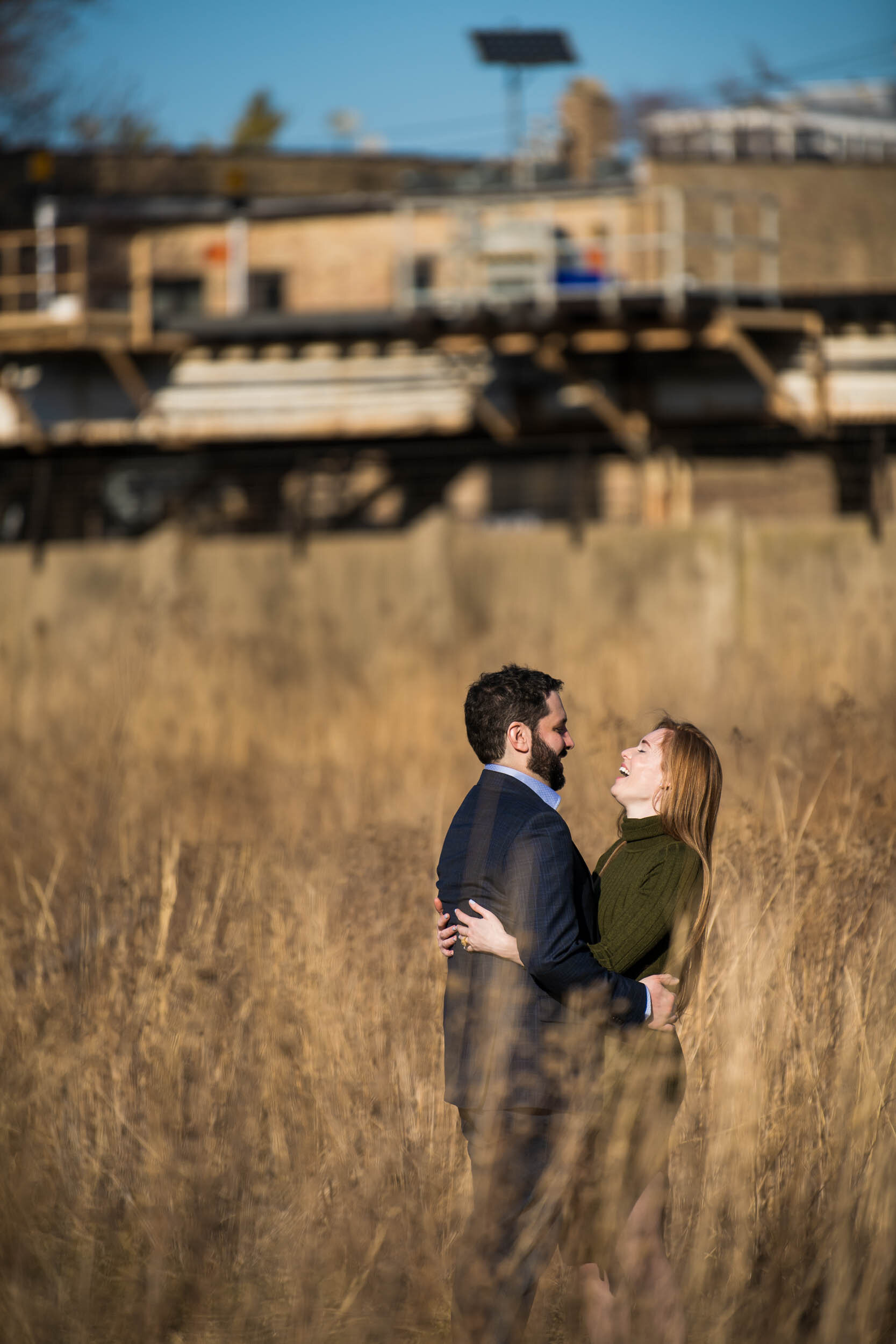 Bride and groom laugh together at Graceland Cemetery: Chicago engagement photo by J. Brown Photography.