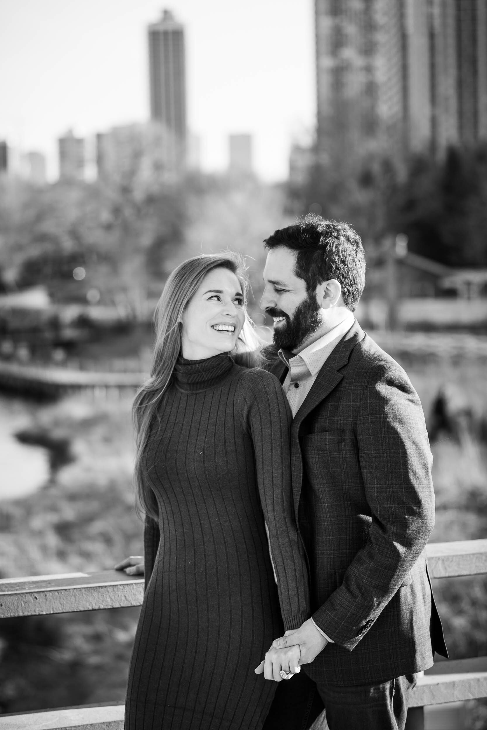 Bride and groom laugh while at Lincoln Park:  Chicago engagement photo by J. Brown Photography.