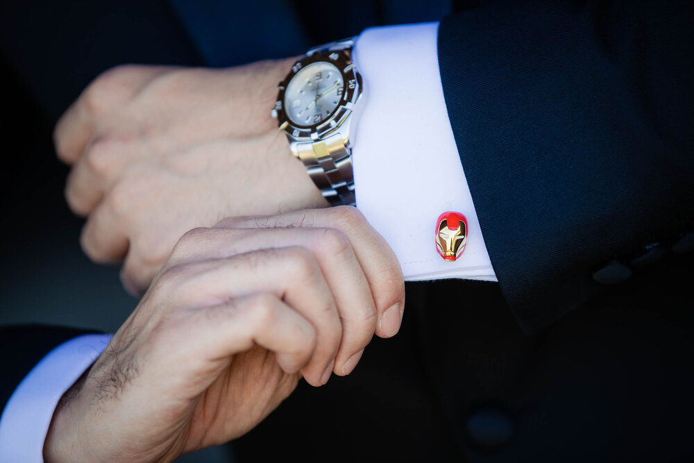 Groom with Ironman cufflinks:  Chicago wedding photography by J. Brown Photography.