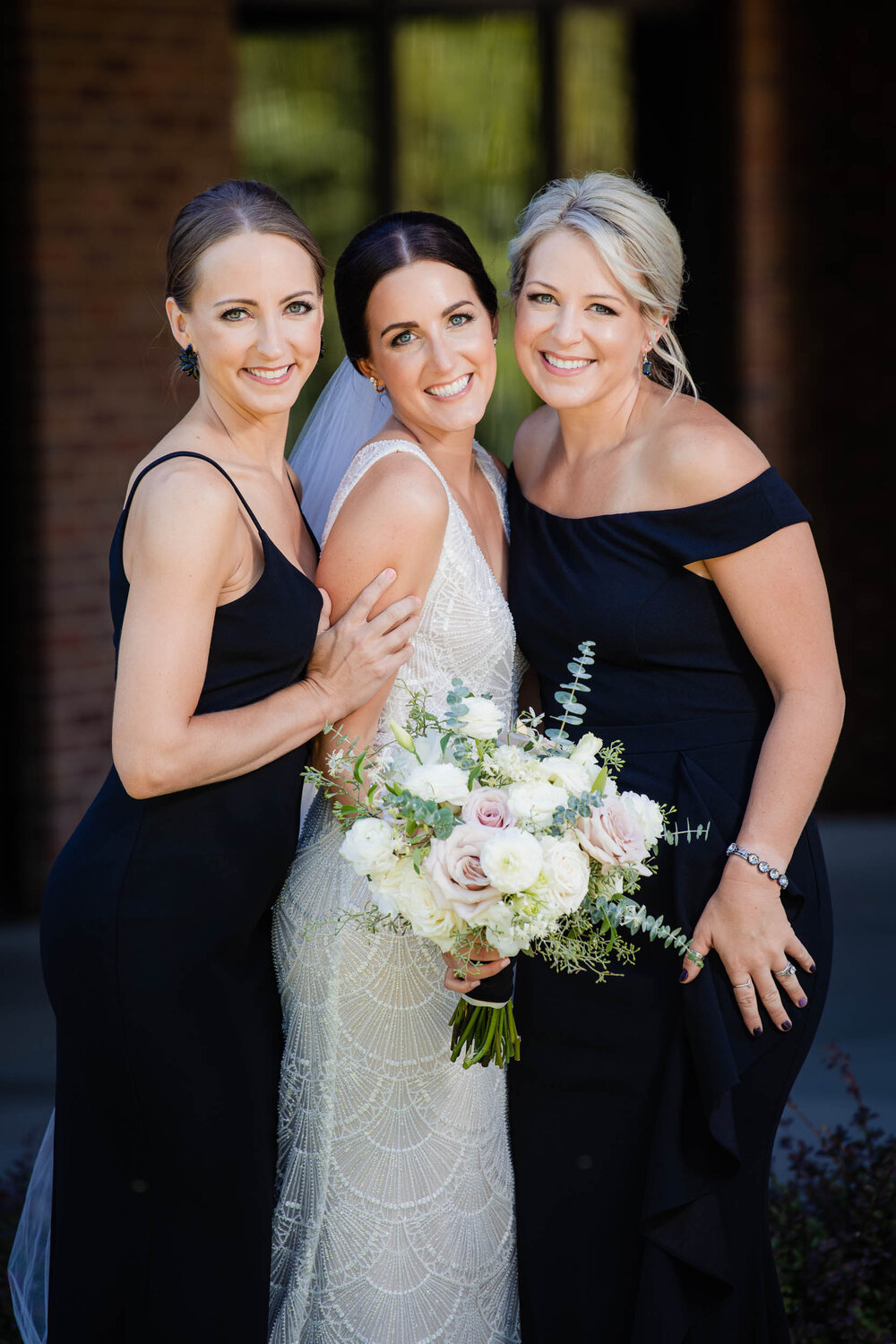 Bride with her bridesmaids on her wedding day:  Chicago wedding photography by J. Brown Photography.