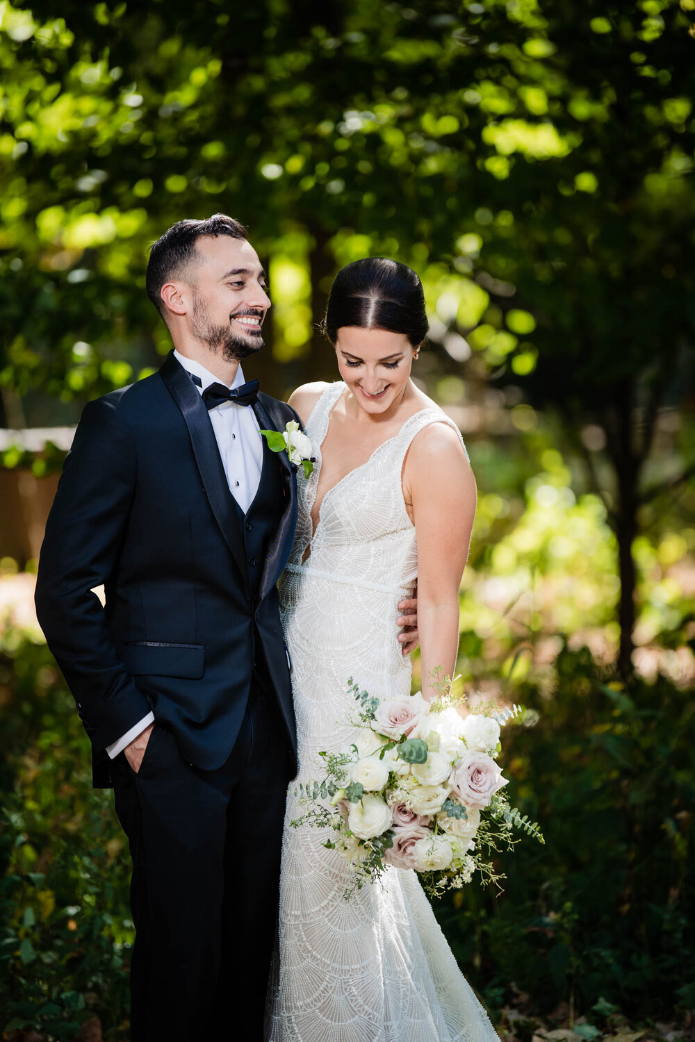 Bride and groom share a laugh during their portraits:  Chicago wedding photography by J. Brown Photography.