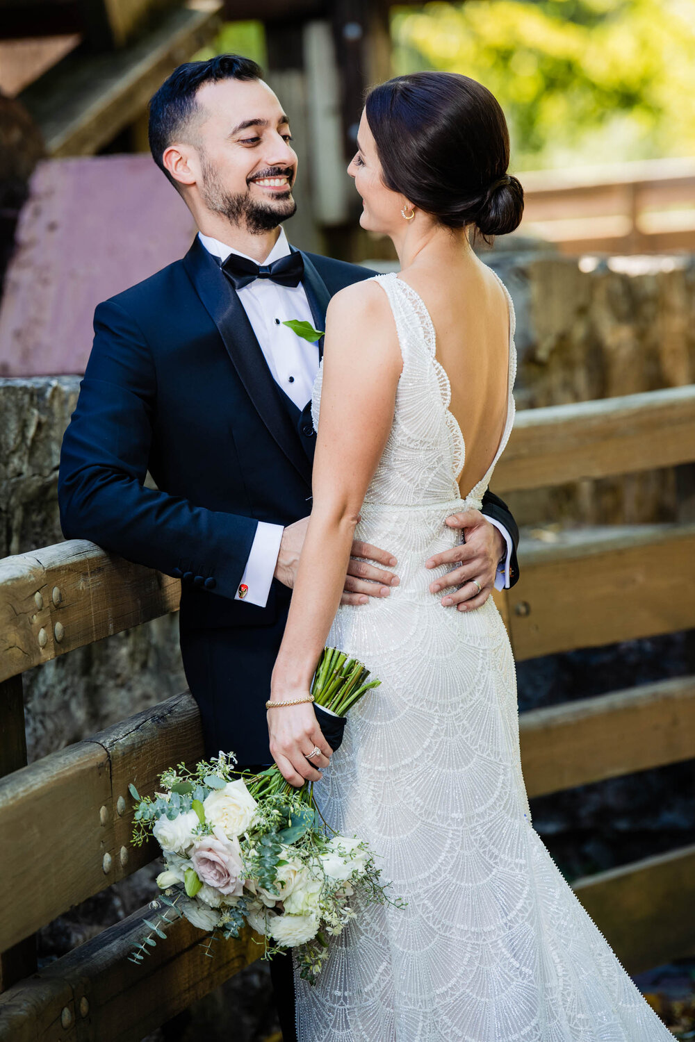 Groom looks to the bride on the wedding day:  Chicago wedding photography by J. Brown Photography.