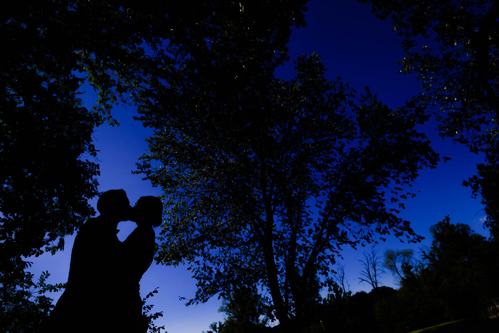 Creative silhouette portrait of the wedding couple:  Chicago wedding photography by J. Brown Photography.