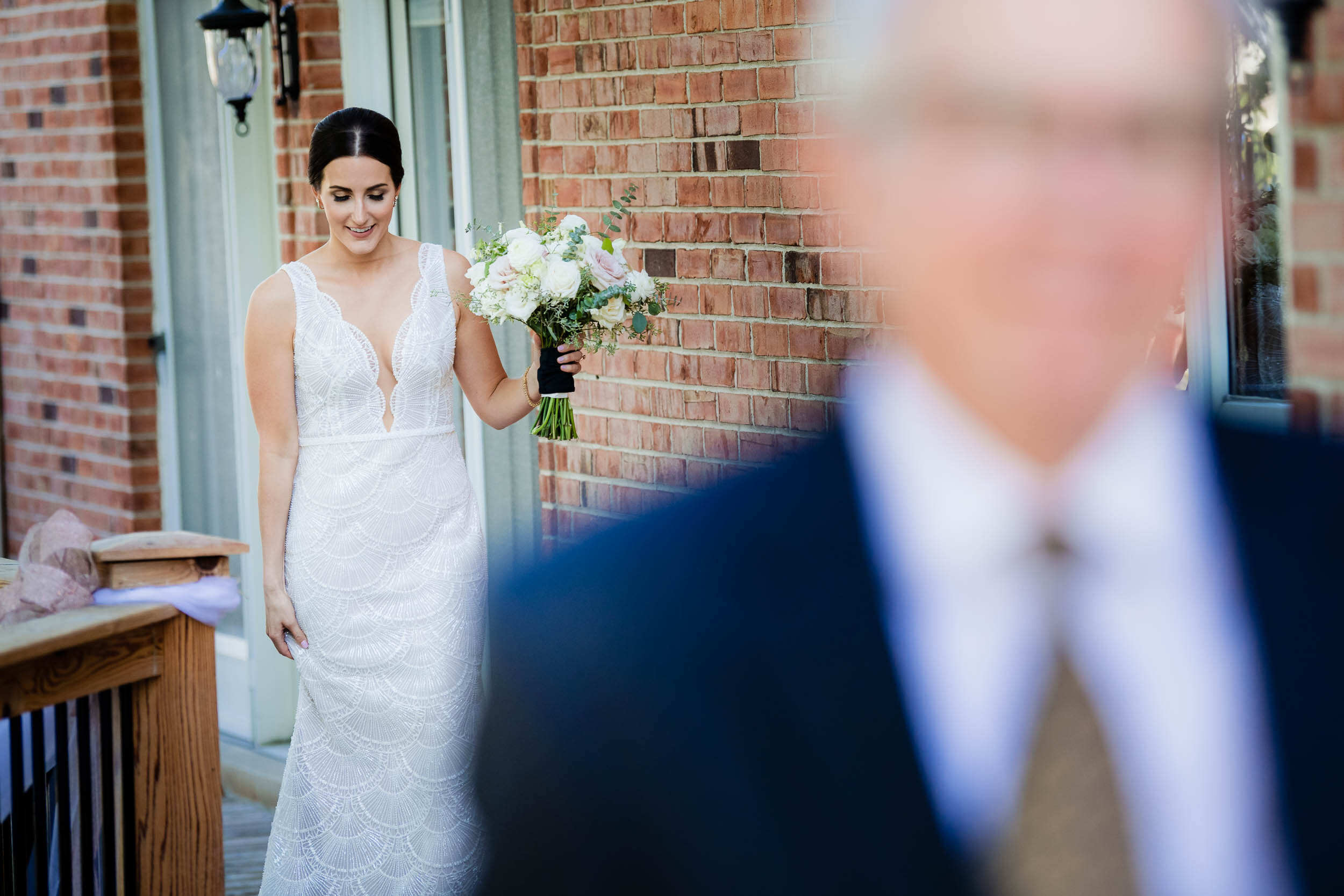 Bride walks to see her father on her wedding day:  Chicago wedding photography by J. Brown Photography.