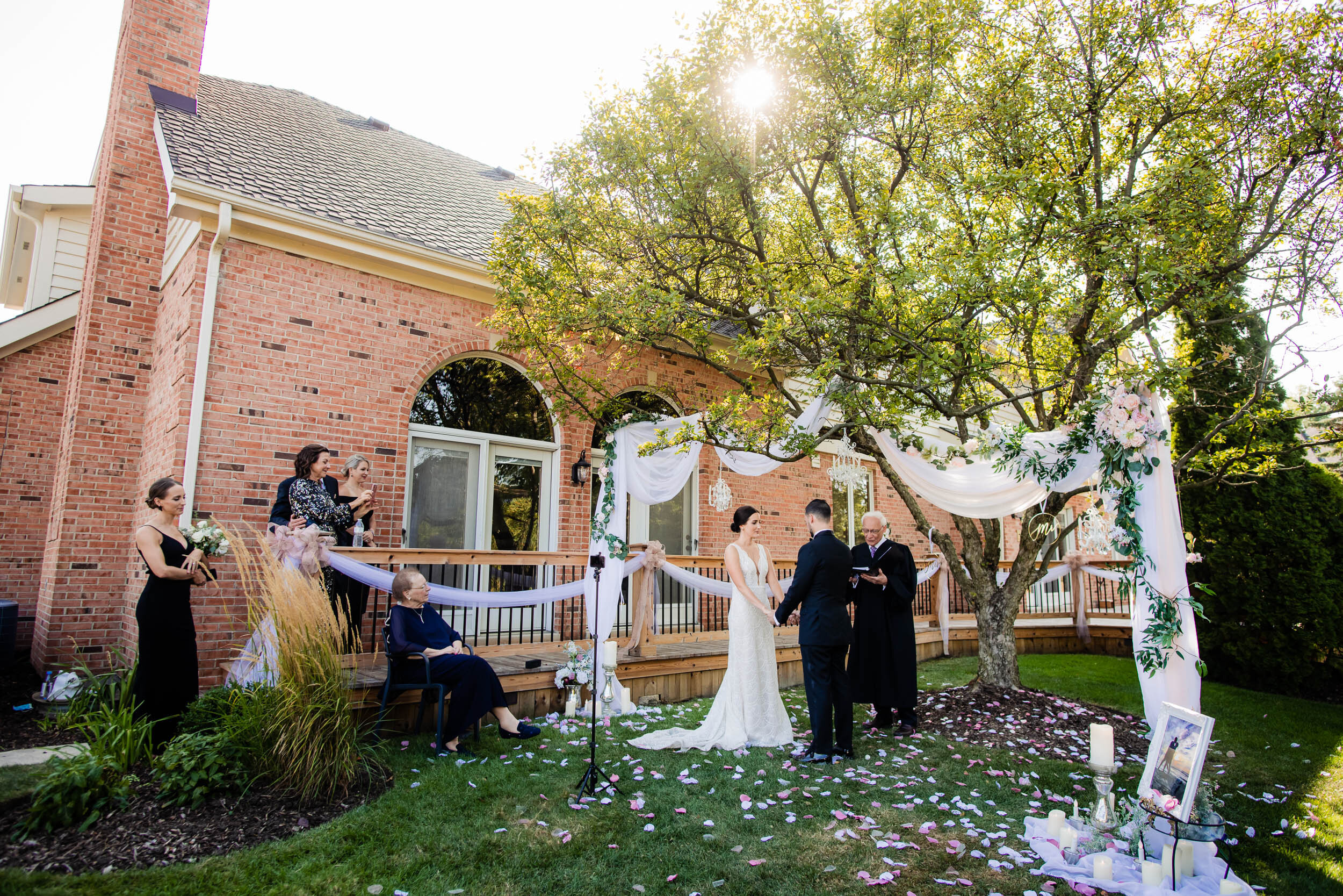 Backyard wedding ceremony in Burr Ridge, Illinois:  Chicago wedding photography by J. Brown Photography.