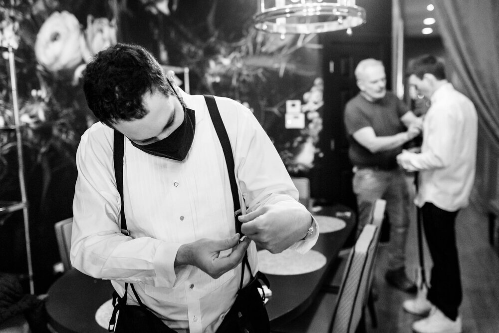 Groom getting ready with his family:  Chicago wedding photographs by J. Brown Photography.