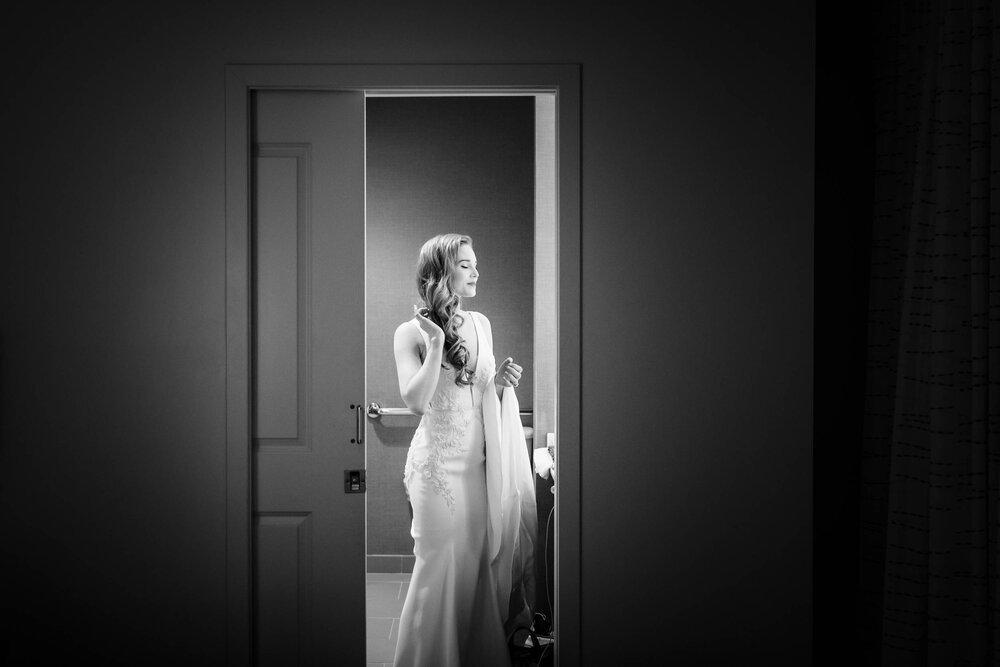 Bride putting on the finishing touches:  Chicago wedding photographs by J. Brown Photography.