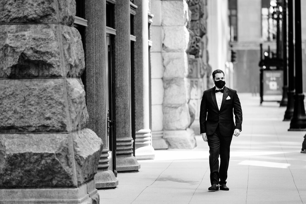 Groom awaits the first look outside the Rookery:  Chicago wedding photographs by J. Brown Photography.