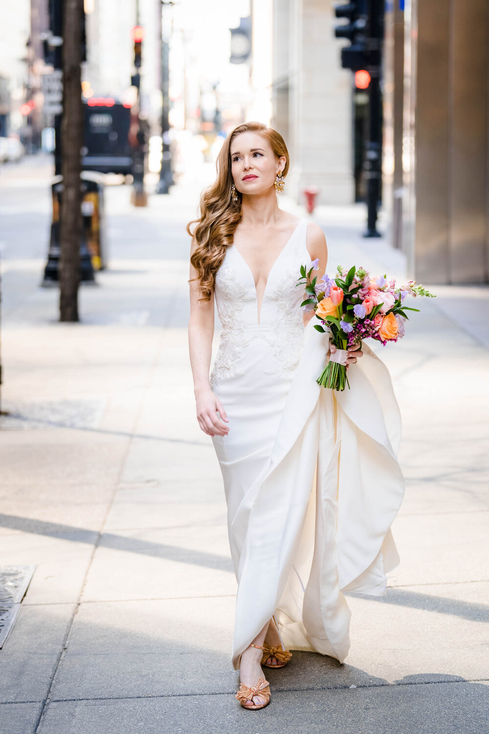Bride walks down LaSalle Street to the first look:  Chicago wedding photographs by J. Brown Photography.