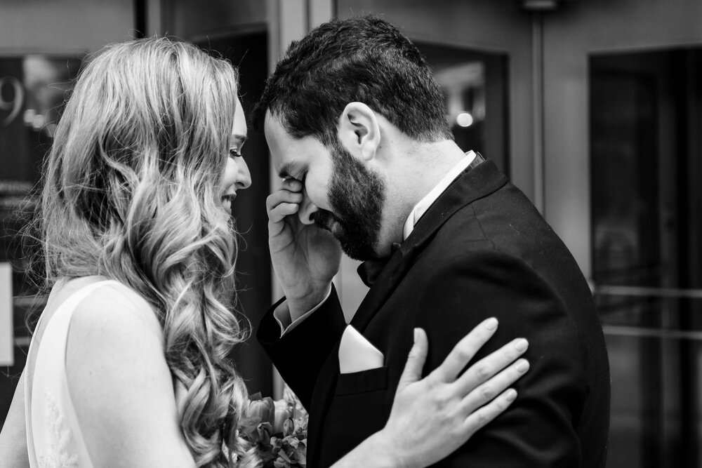 Emotional first look moment:  Chicago wedding photographs by J. Brown Photography.