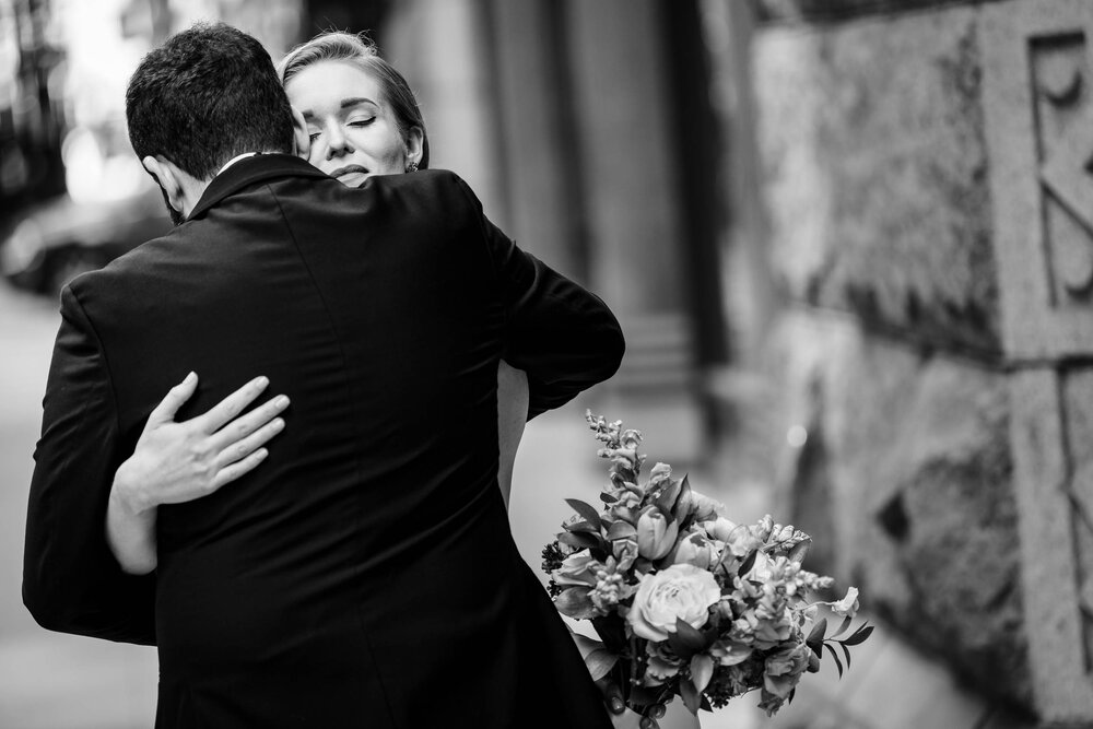 Emotional first look moment between the bride and groom:  Chicago wedding photographs by J. Brown Photography.