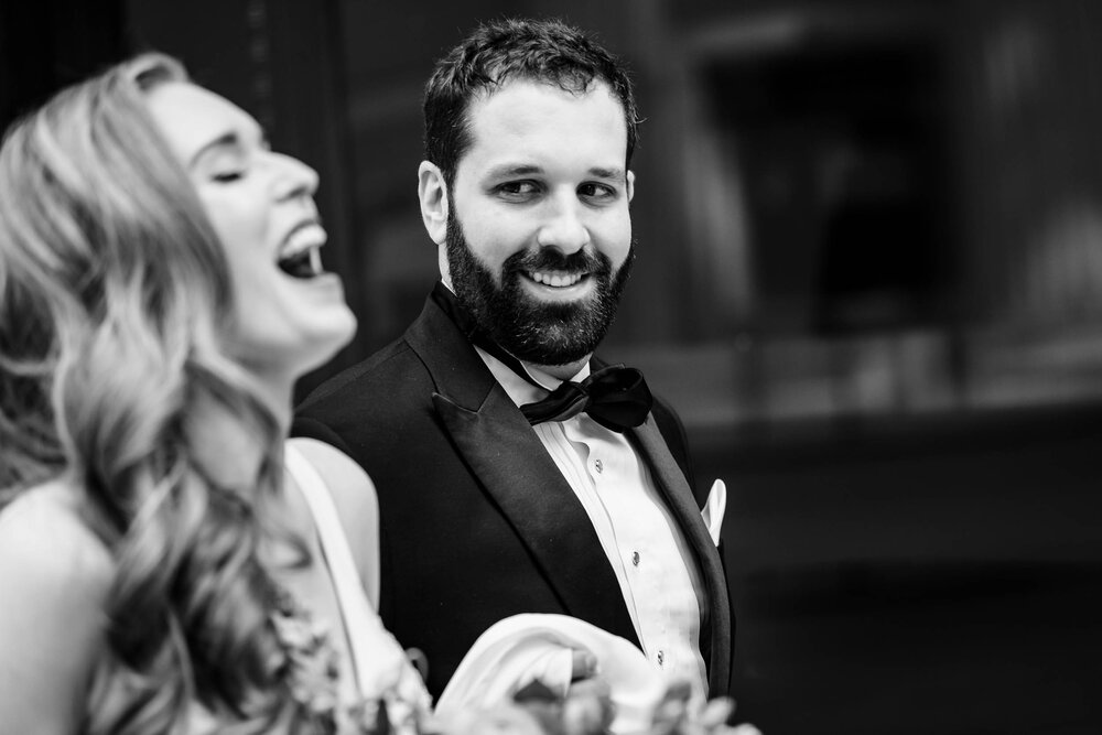 Candid funny moment between the couple:  Chicago wedding photographs by J. Brown Photography.