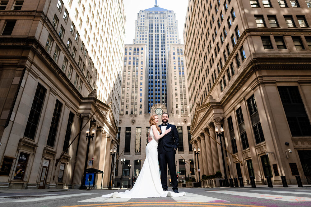 Epic portrait on LaSalle Street outside the Board of Trade:  Chicago wedding photographs by J. Brown Photography.