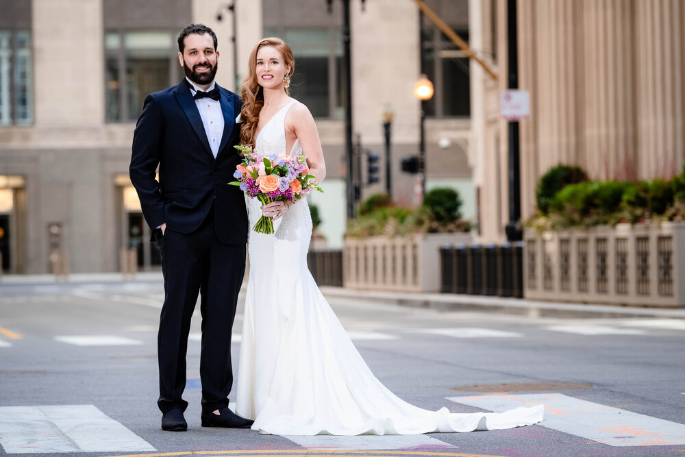 Classic portrait of the bride and groom near the Board of Trade:  Chicago wedding photographs by J. Brown Photography.