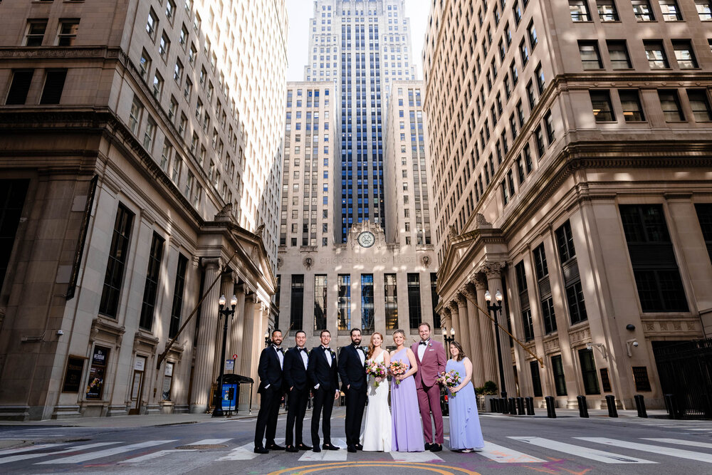 Wedding party group portrait outside the Board of Trade:  Chicago wedding photographs by J. Brown Photography.