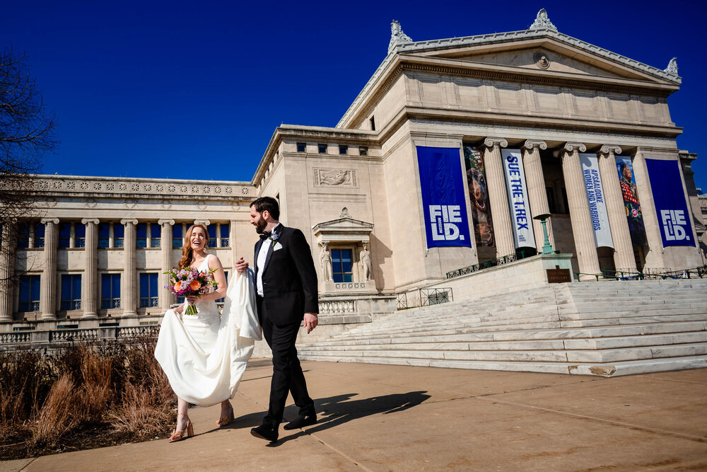 Fun creative portrait of the bride and groom near the Field Museum:  Chicago wedding photographs by J. Brown Photography.