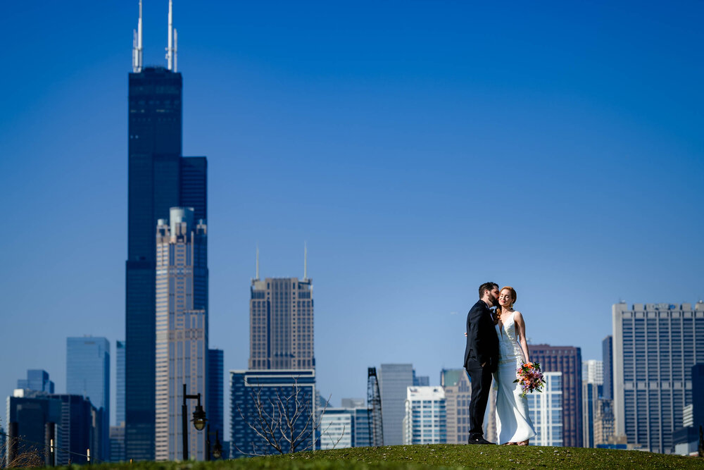 Epic creative portrait of the bride and groom with the skyline at Ping Tom Park:  Chicago wedding photographs by J. Brown Photography.