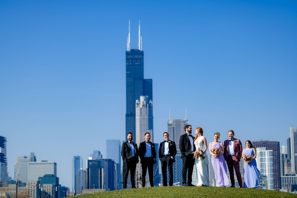 Wedding party portrait at Ping Tom Park with the skyline:  Chicago wedding photographs by J. Brown Photography.