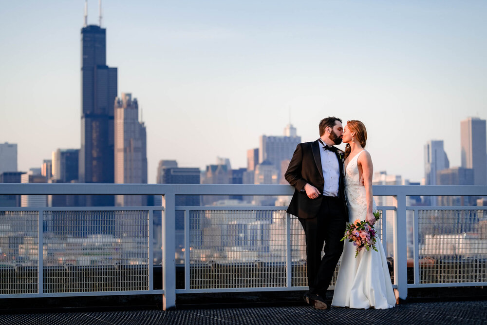 Sunset portrait of the couple on the rooftop of the Stockhouse: Chicago wedding photographs by J. Brown Photography.