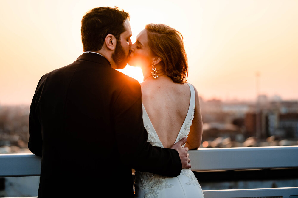 Creative portrait of the bride and groom at sunset on the rooftop of the Stockhouse:  Chicago wedding photographs by J. Brown Photography.