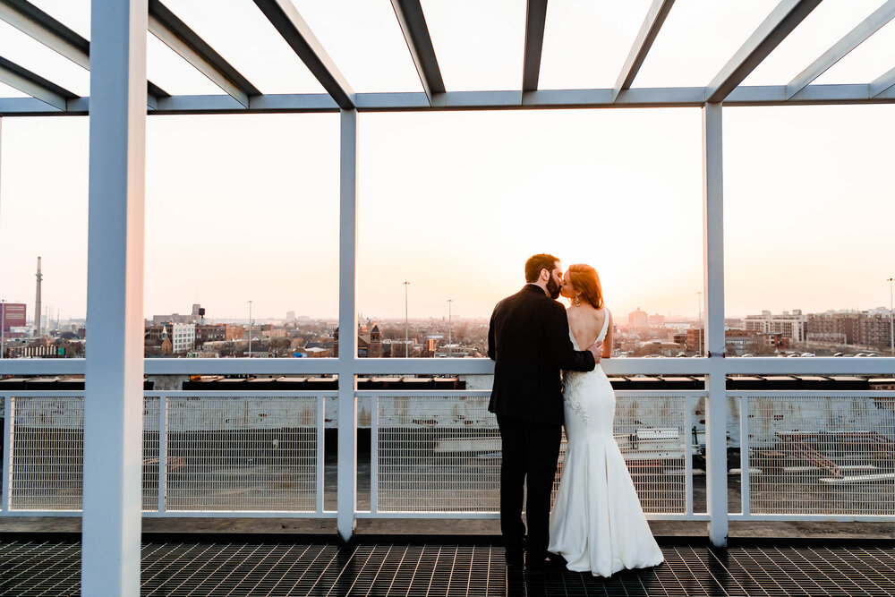 Sunset portrait of the bride and groom on the rooftop of the Stockhouse: Chicago wedding photographs by J. Brown Photography.