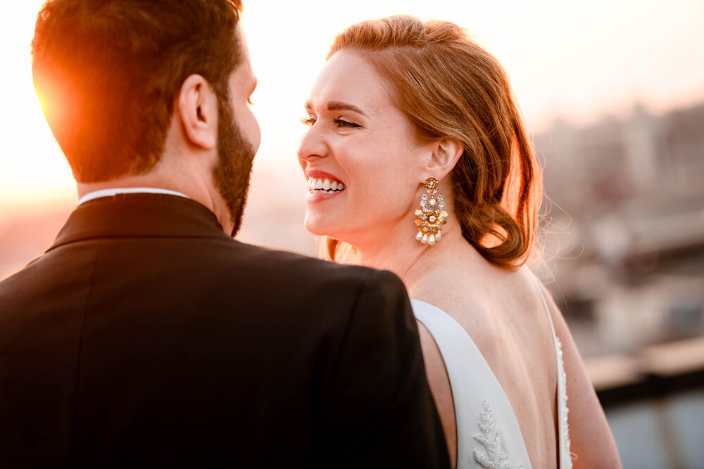 Fun moment with the couple at sunset on the rooftop of the Stockhouse:  Chicago wedding photographs by J. Brown Photography.