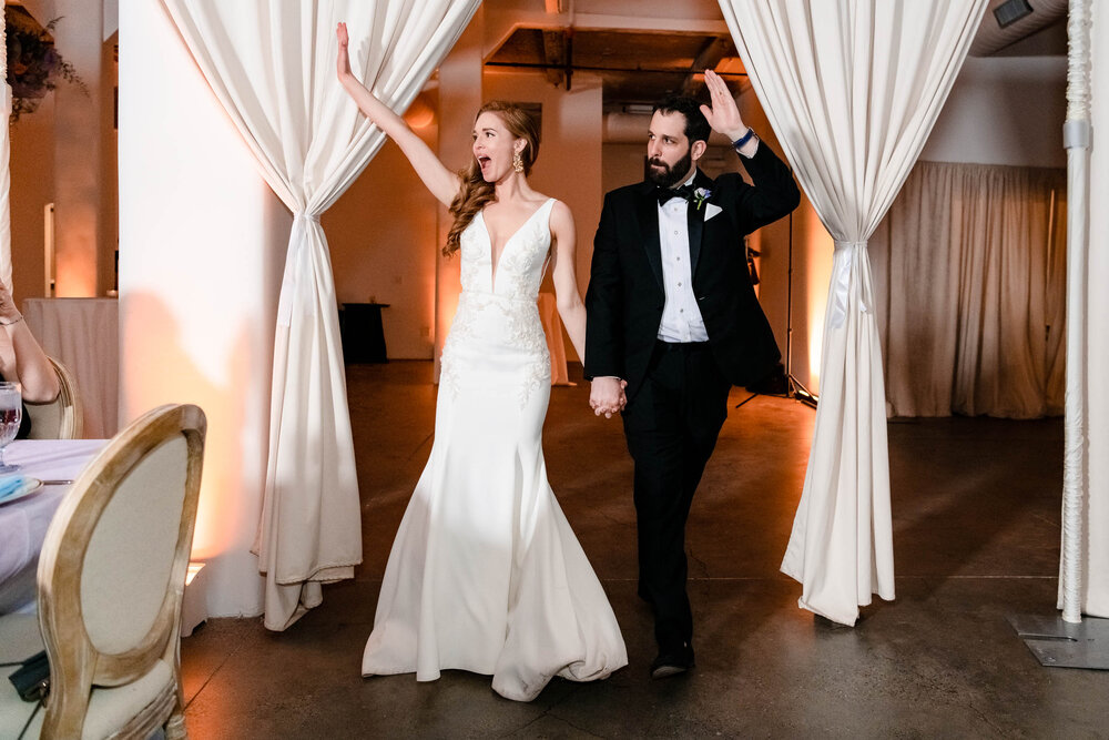 Bride and groom are introduced at their reception at the Stockhouse:  Chicago wedding photographs by J. Brown Photography.