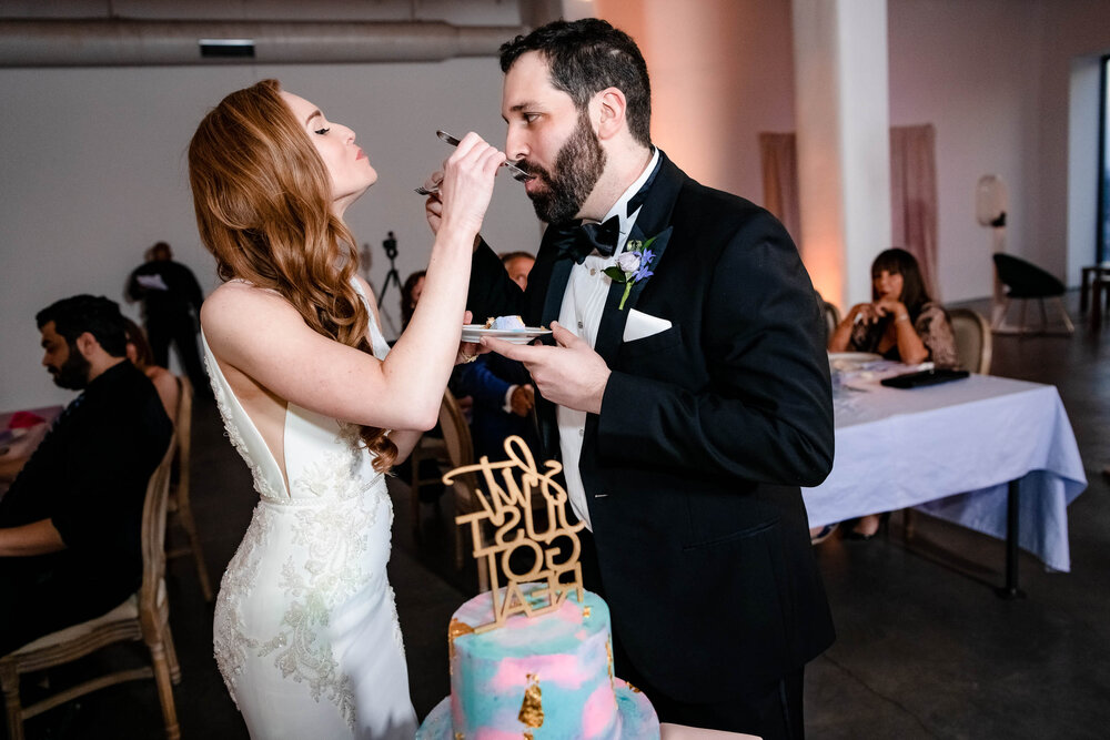 Cake cutting moment at the Stockhouse:  Chicago wedding photographs by J. Brown Photography.