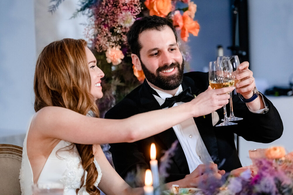 Bride and groom toast during their reception at the Stockhouse: Chicago wedding photographs by J. Brown Photography.