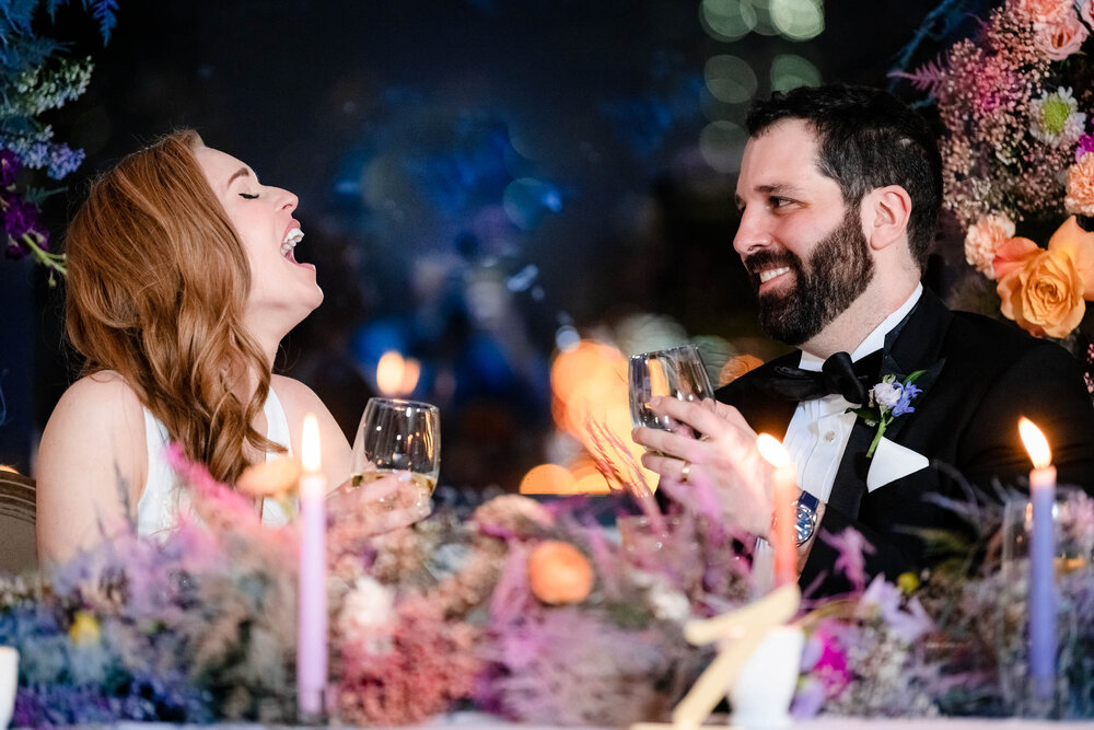 Bride and groom share a laugh during their reception at the Stockhouse:  Chicago wedding photographs by J. Brown Photography.