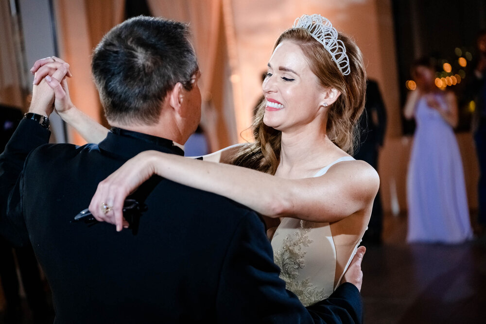 Bride and father share a moment during their dance at the Stockhouse: Chicago wedding photographs by J. Brown Photography.