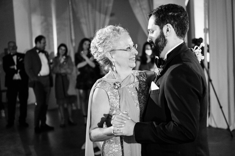 Mother son dance during a reception at the Stockhouse: Chicago wedding photographs by J. Brown Photography.