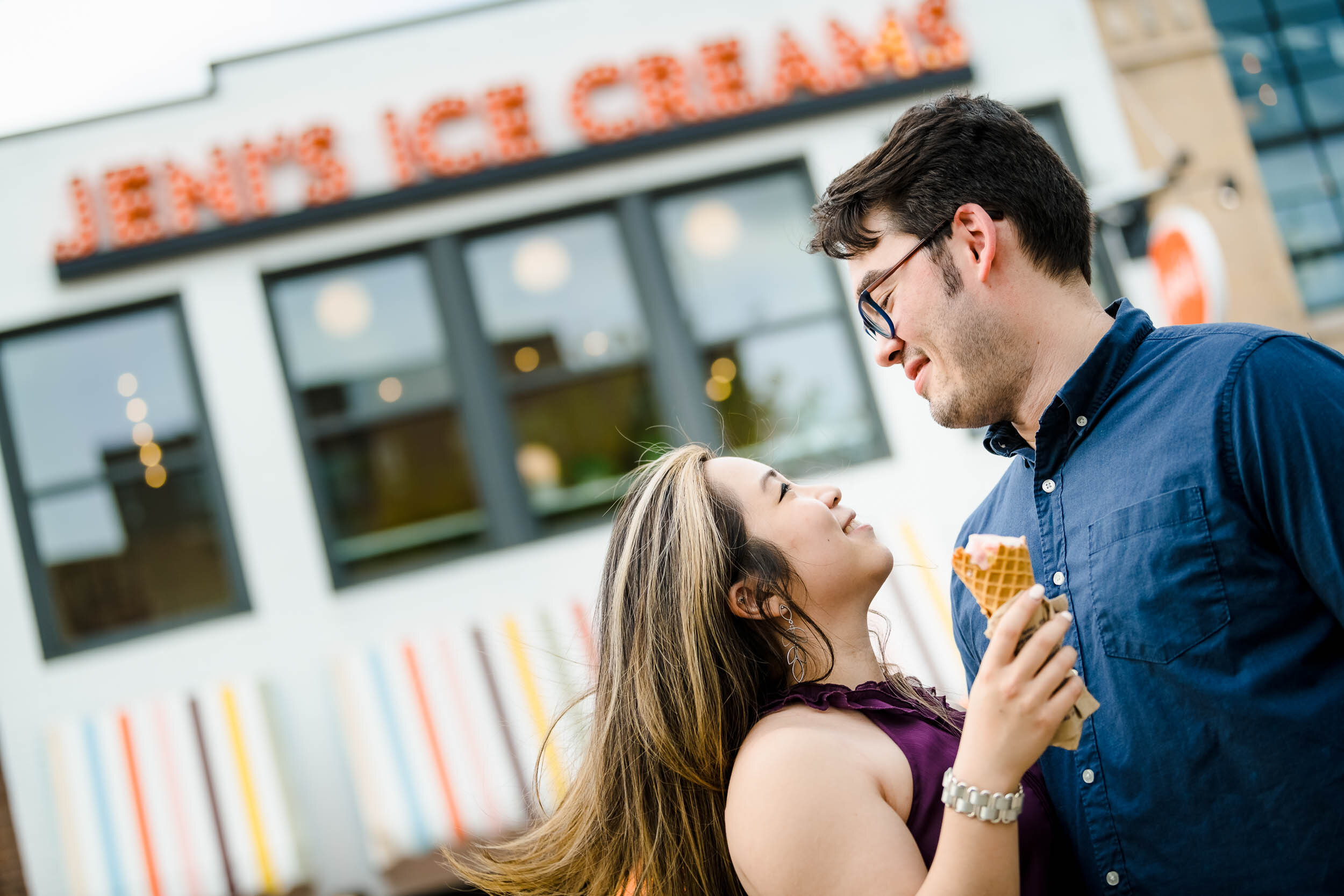 Best Engagement Photographers Near Me | Jeni's Ice Cream | J. Brown Photography | couple kisses after sharing an ice cream cone.