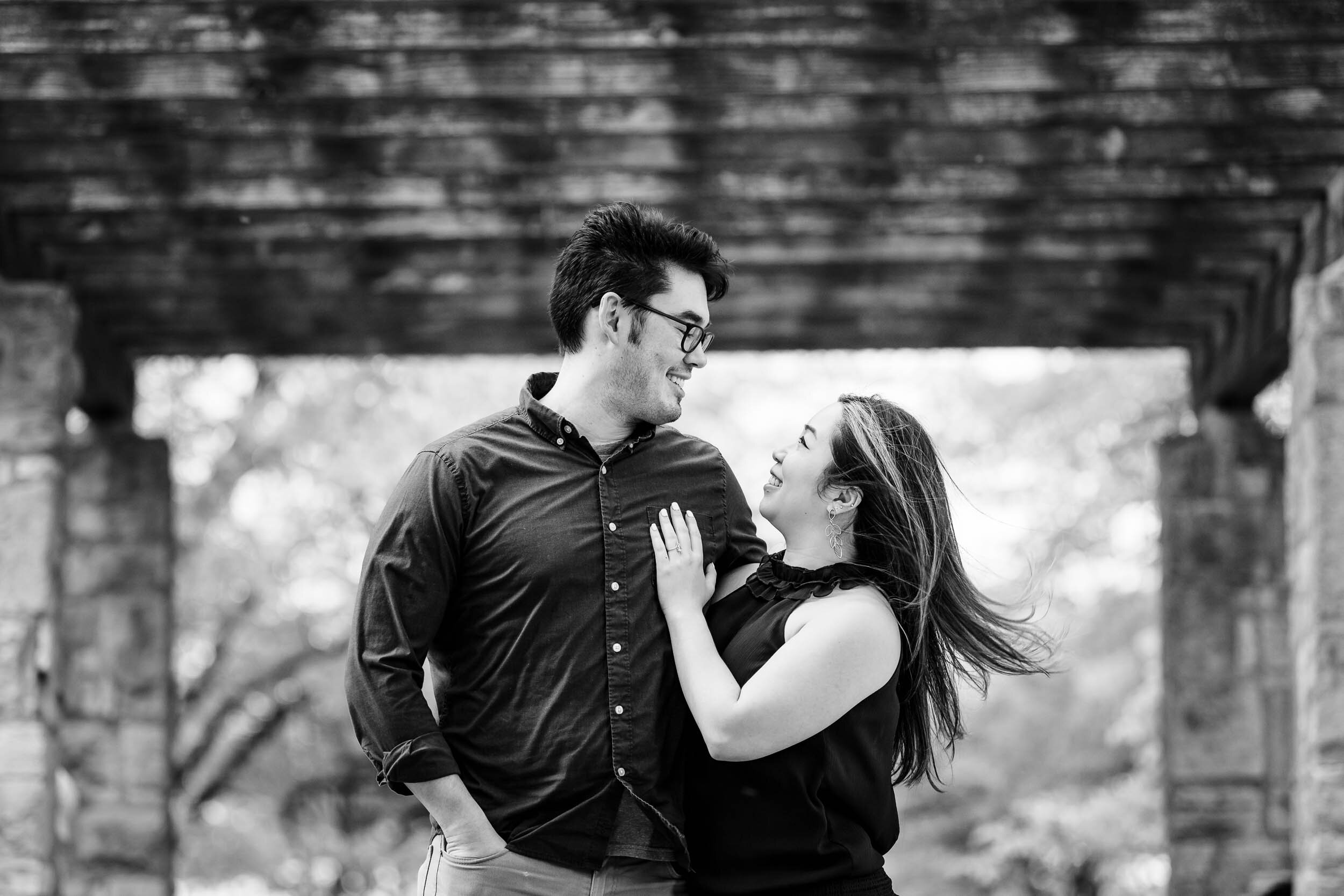 Best Engagement Photographers Near Me | Milton Lee Olive Park | J. Brown Photography | black and white photo of couple under pergola.