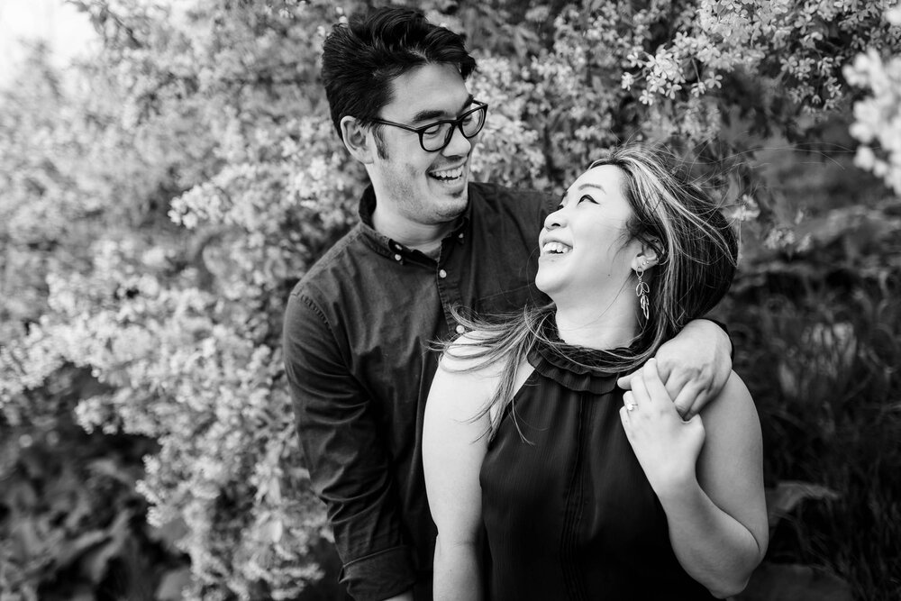 Best Engagement Photographers Near Me | Milton Lee Olive Park | J. Brown Photography | black and white photo of couple laughing.