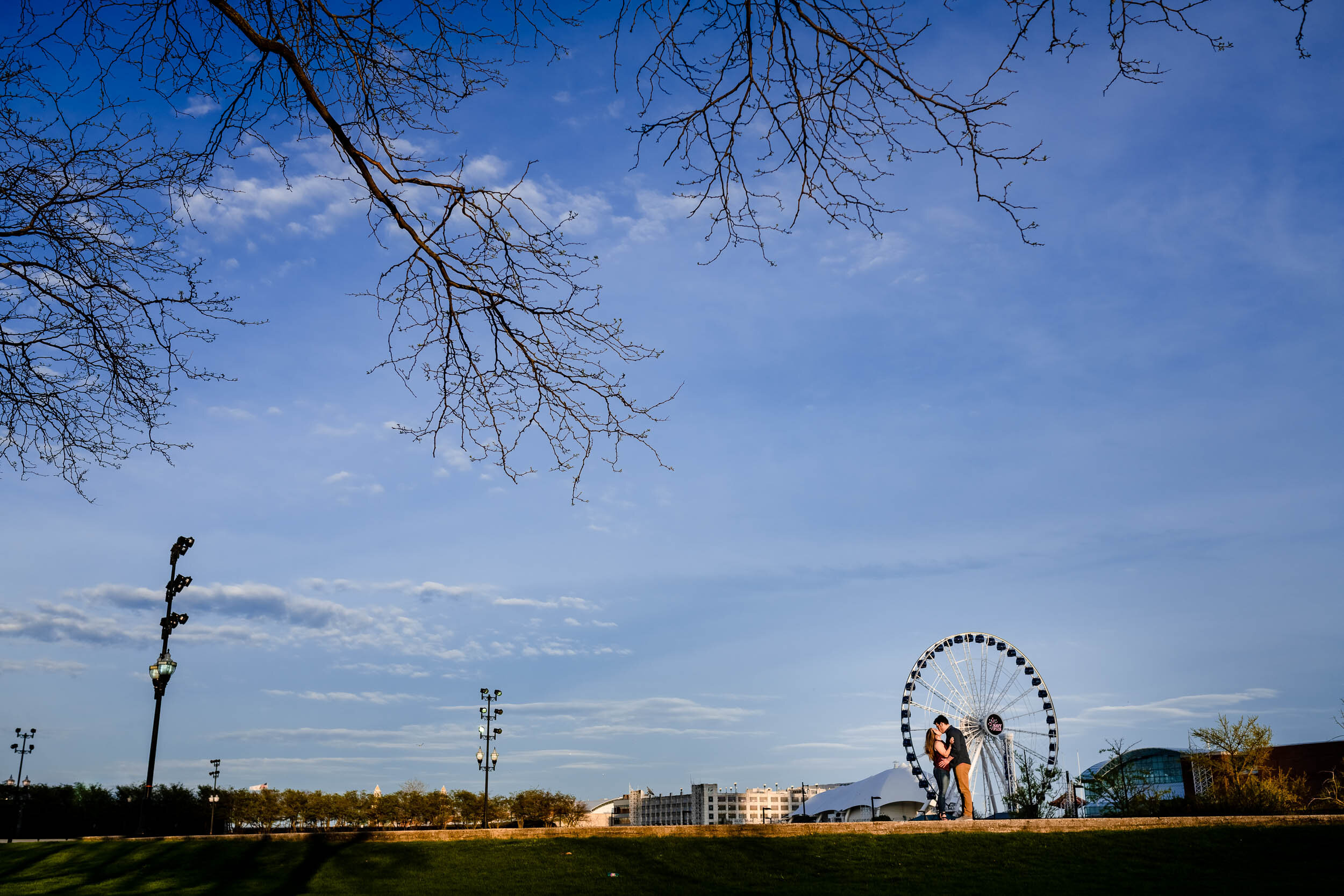 Engagement Photographer Chicago | Milton Lee Olive Park | J. Brown Photography | portrait of couple with a ferris wheel.