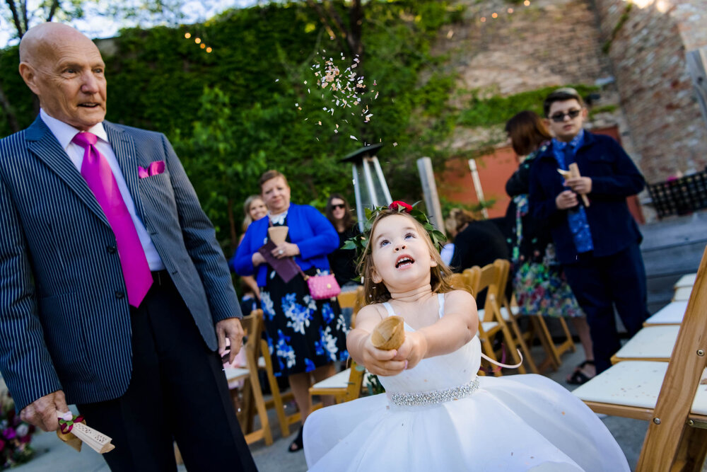 Top Wedding Photographers Near Me | City Winery | J. Brown Photography | funny moment of flower girl with confetti.