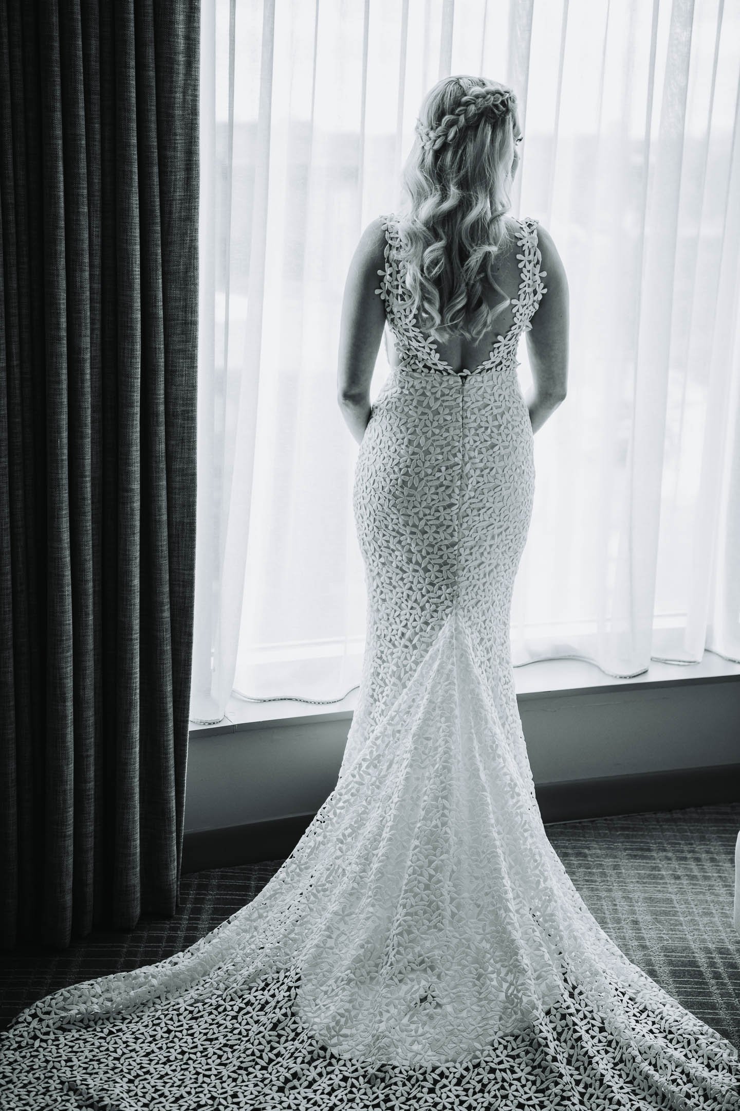 Top Wedding Photographers Near Me | Ravenswood Event Center | J. Brown Photography | creative portrait of bride at Hotel Zachary wedding suite