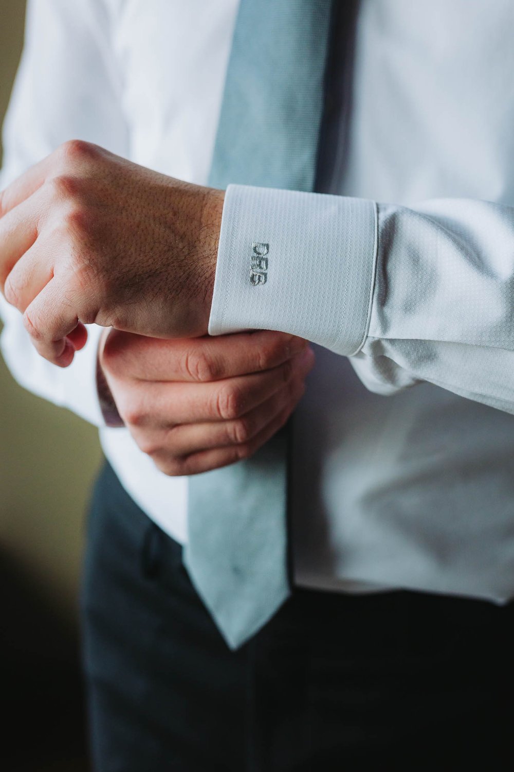 Top Wedding Photographers Near Me | Ravenswood Event Center | J. Brown Photography | groom detail photo of cuffs