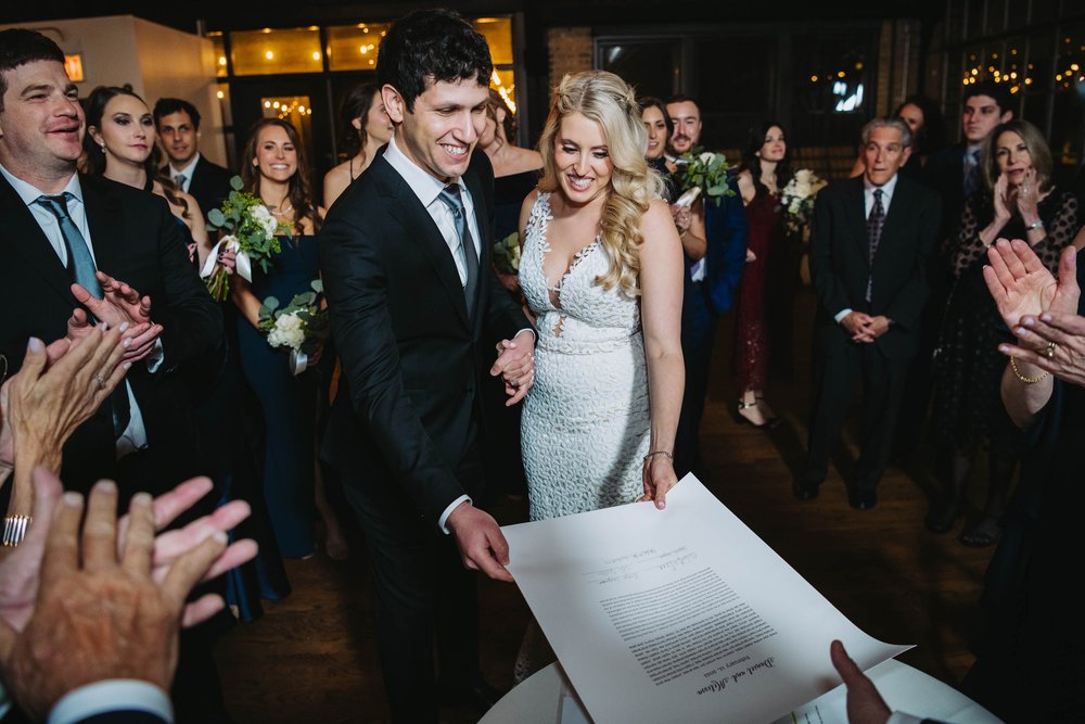 Wedding Day Photos | Ravenswood Event Center | J. Brown Photography | couple receives signed ketubah