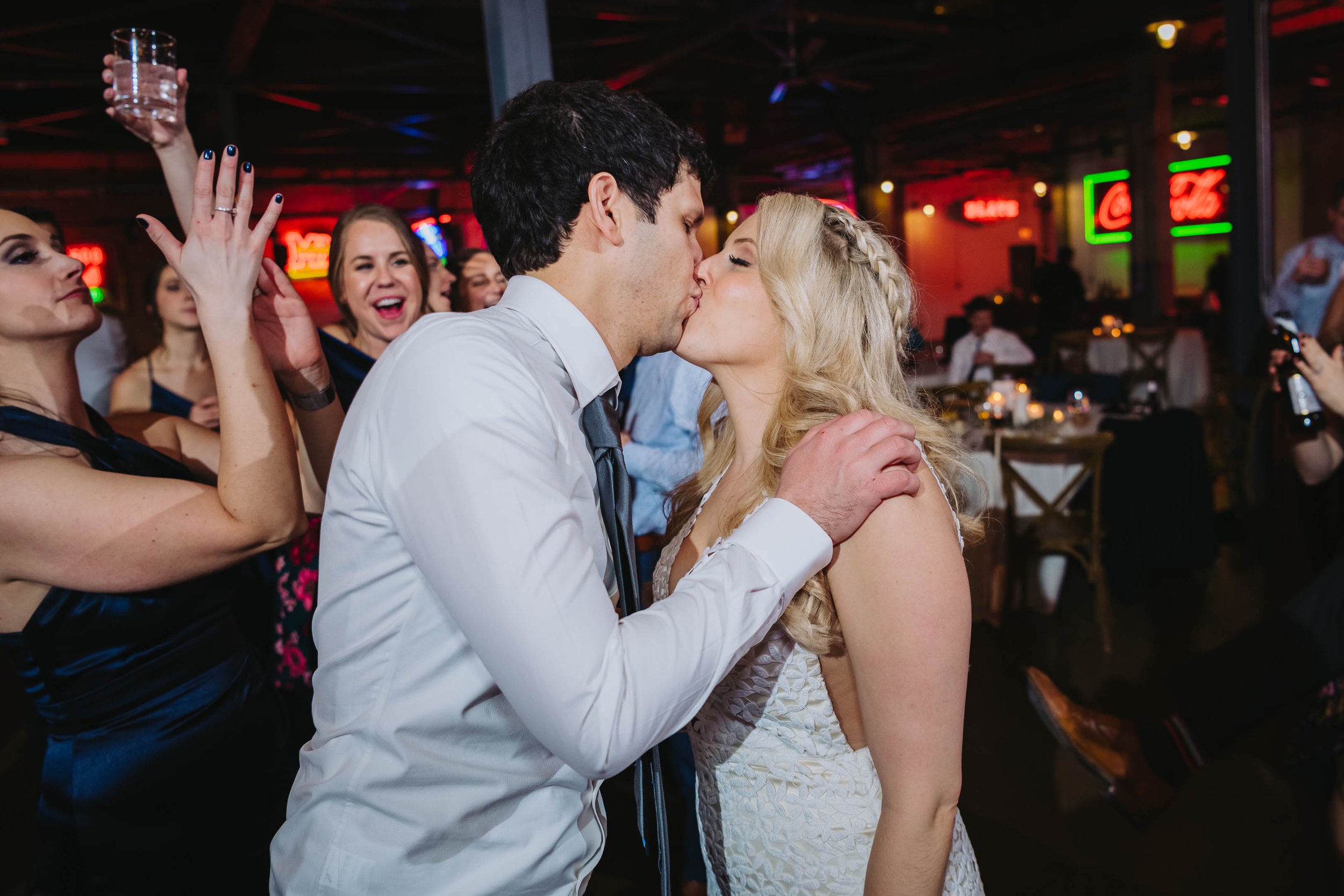 Top Wedding Photographers Near Me | Ravenswood Event Center | J. Brown Photography | bride and groom kiss dance floor