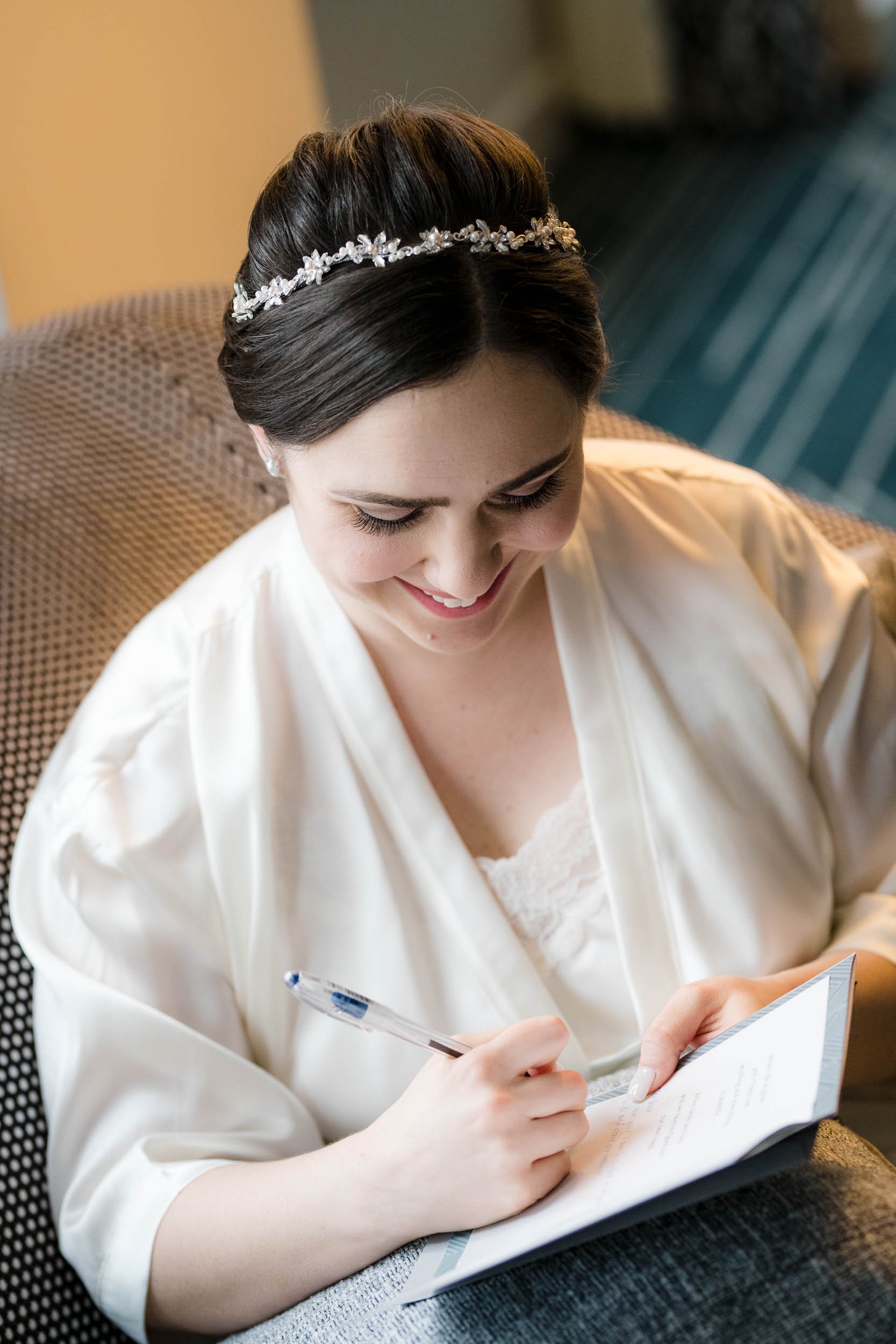 Best Wedding Photographers Near Me | Newberry Library | J. Brown Photography | bride writes a note to her groom.