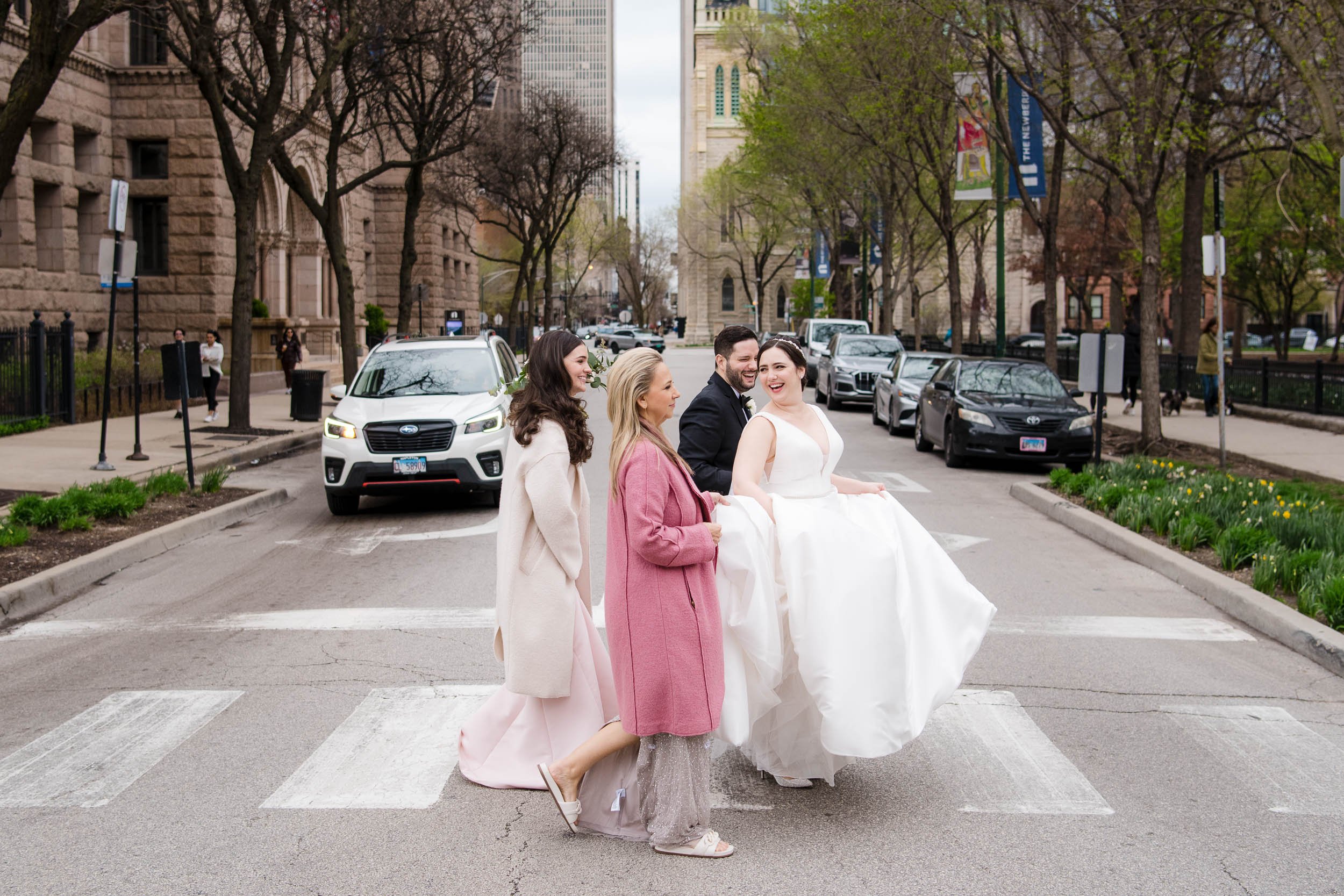 Wedding Day Photos | Newberry Library | J. Brown Photography | candid photo of bride and groom walking in Chicago. 