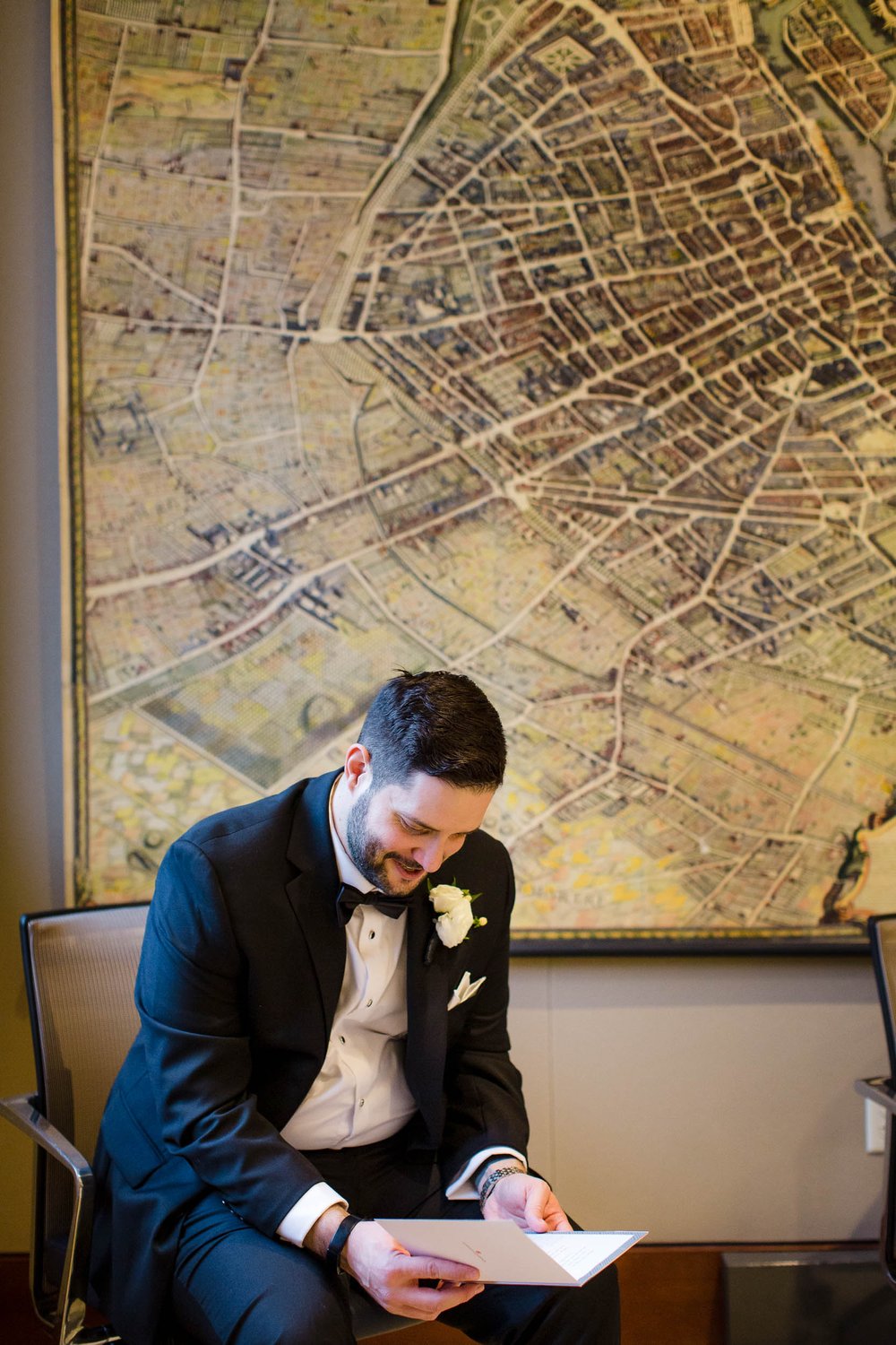 Chicago Wedding Photographer | Newberry Library | J. Brown Photography | groom reads note from bride. 