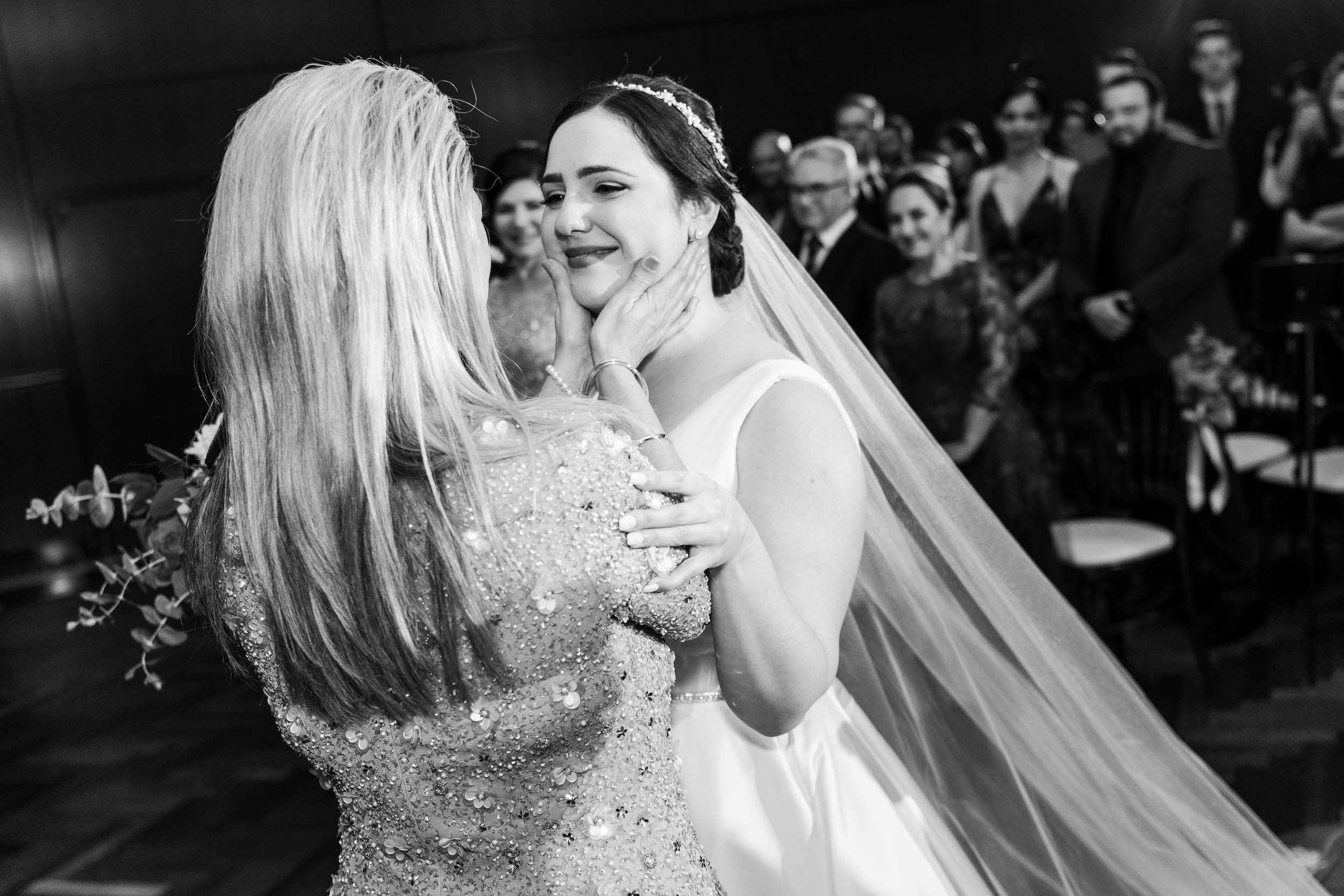 Wedding Day Photos | Newberry Library | J. Brown Photography | mom and bride embrace during the ceremony.