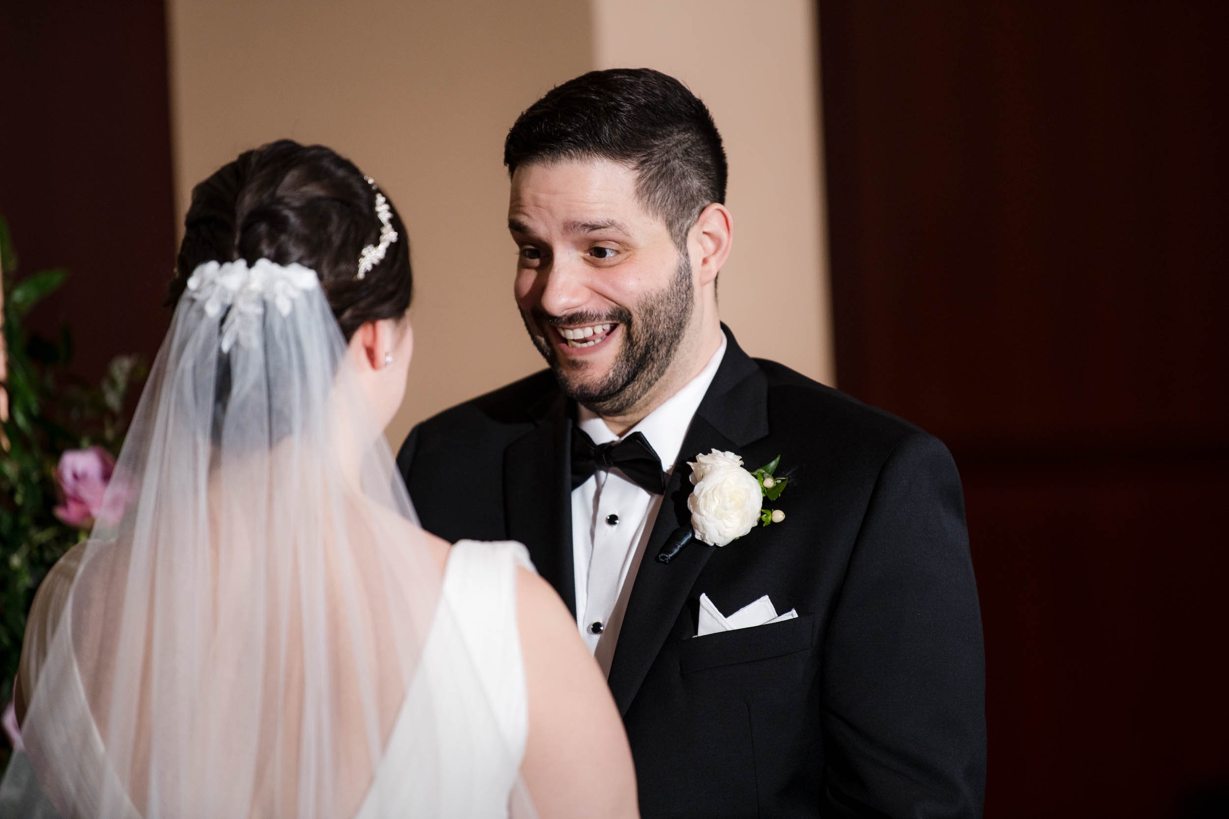 Best Wedding Photographers Near Me | Newberry Library | J. Brown Photography | grooms smiles to his bride at ceremony.
