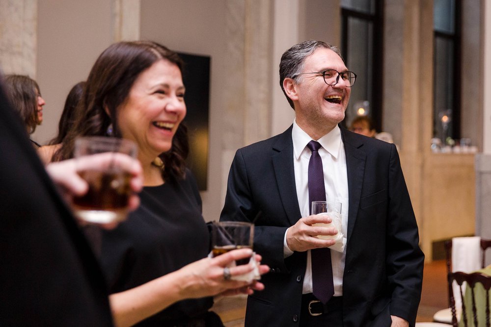 Chicago Wedding Photographer | Newberry Library | J. Brown Photography | guests laugh during cocktail hour.