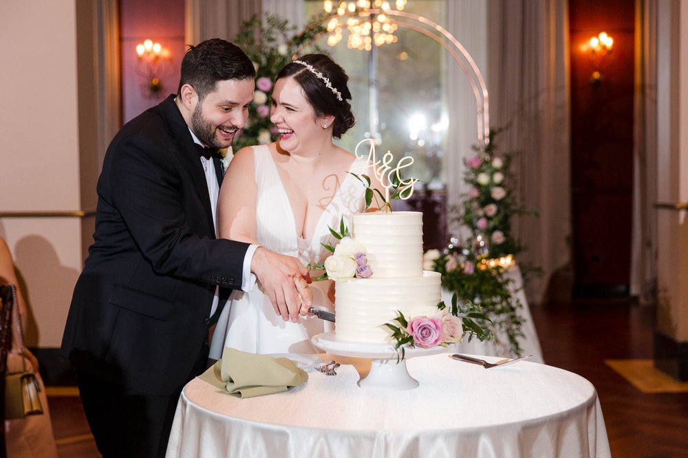 Wedding Day Photos | Newberry Library | J. Brown Photography | bride and groom cut the cake. 