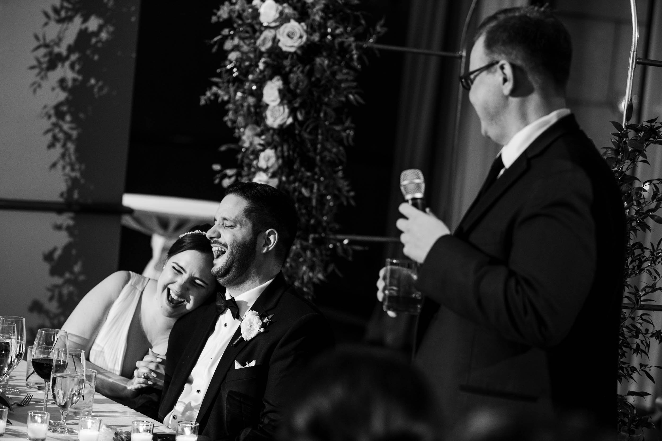 Best Wedding Photographers Near Me | Newberry Library | J. Brown Photography | couple laughs during the best man toast.