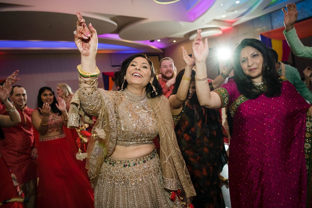 Indian Wedding Photographers | Renaissance Schaumburg | J. Brown Photography | mother of the bride on the dance floor.